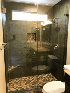 Shower with tile walls and a glass shower enclosure